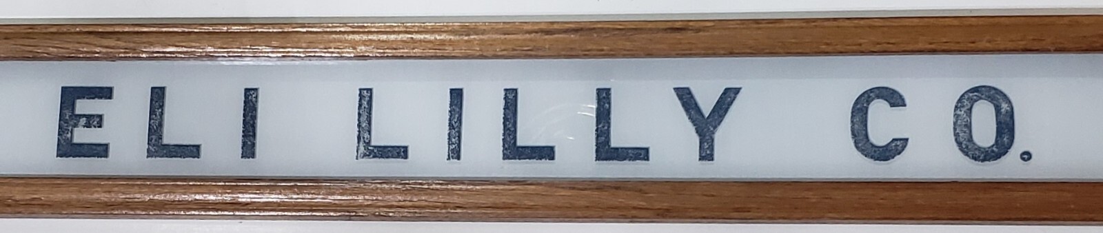 Vintage Eli Lilly Co. Milk White Glass Sign in Frame 6 3/4″ x 4 3/4″ GS00329