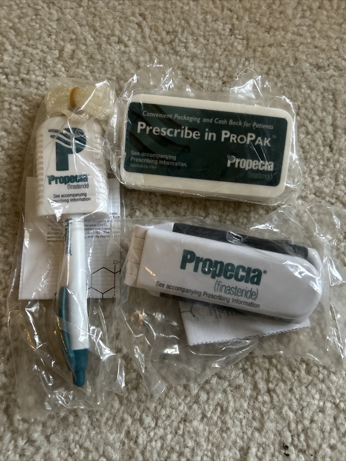 Lot Of 3 -Rare Propecia PEN ON STRING, Hair Brush, Magnet Clip-All Wrapped Merck