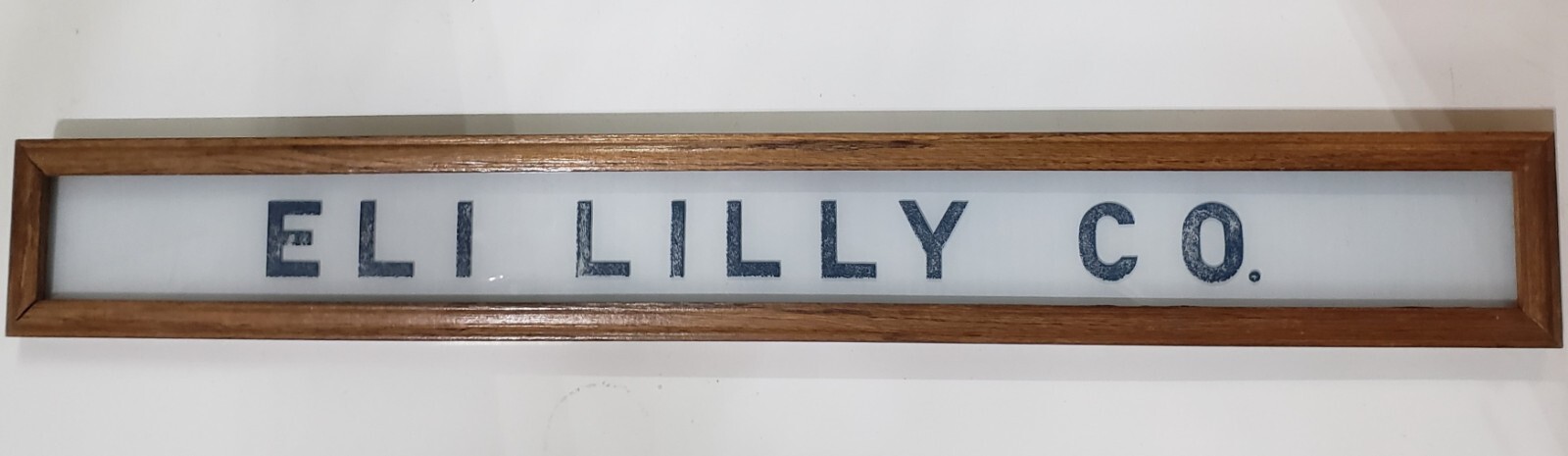 Vintage Eli Lilly Co. Milk White Glass Sign in Frame 6 3/4″ x 4 3/4″ GS00329