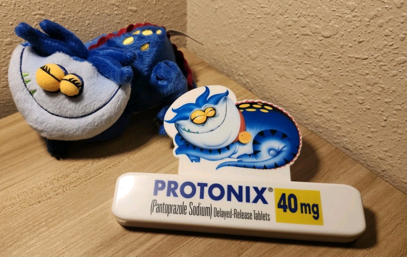 Vtg Protonix Magnet Clip Pharmaceutical Rep Advertisement With Plushy
